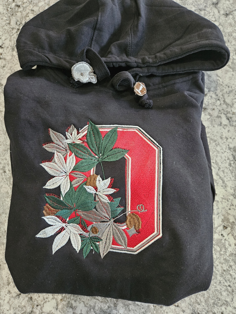 Black Hoodie with Red Appliqué 'O' and Leaf Embroidery